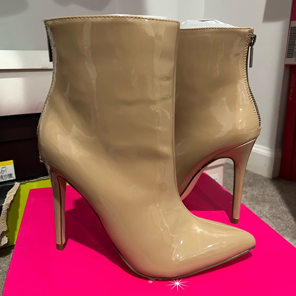 Nude colored patent leather high heeled booties